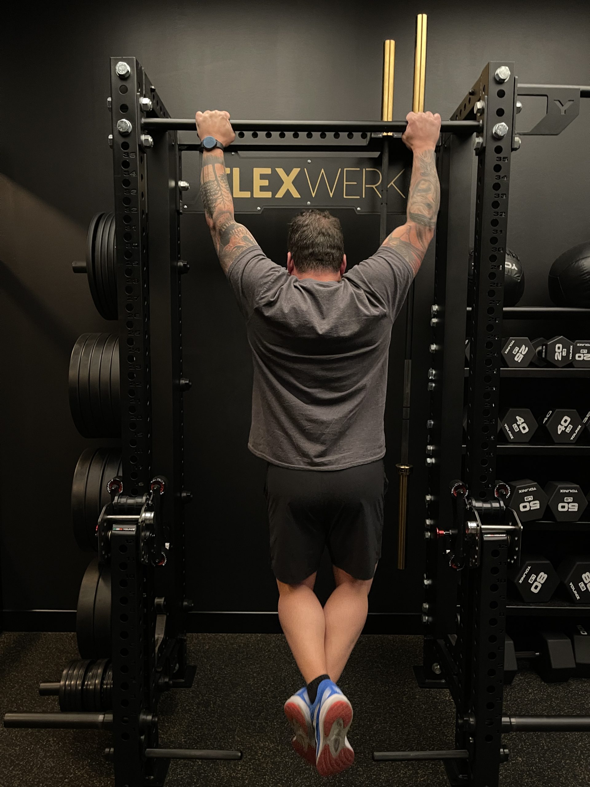 fitness-service-01 Weighted pull-up during a personal training session at FlexWerk Fitness in Carmel