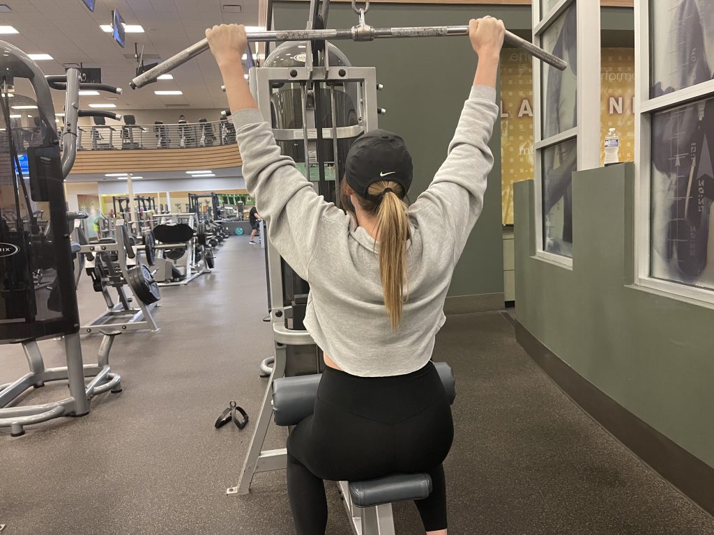 Client performing lat pulldowns during a training session